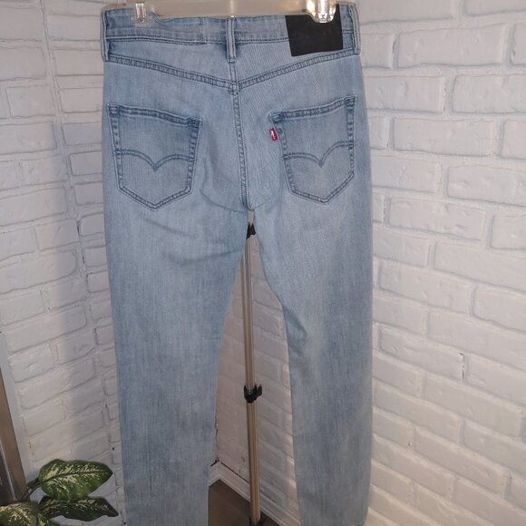 Levi's 511 Commuter Unisex Coolmax 2 Way Stretch Lt Wash Blue Jeans - Picture 2 of 16